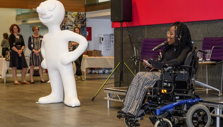 Speech in front of morph statue