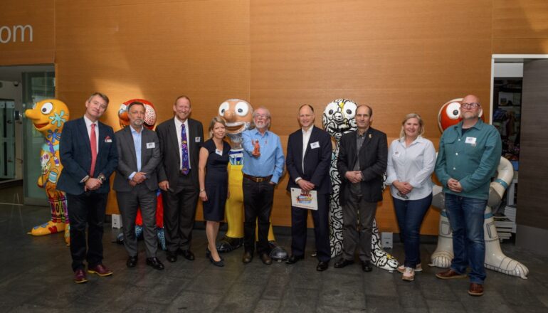 Group photo in front of morph sculptures