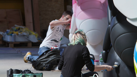 Artists painting bee in the city bees