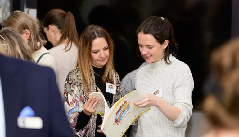 People looking though images of the sculptures